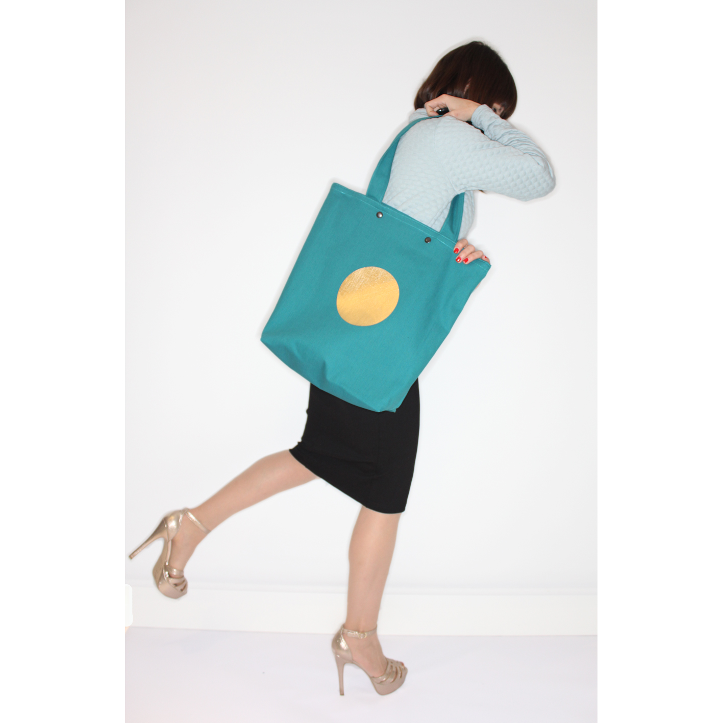 Big green denim shopper with golden sun and cotton lining.