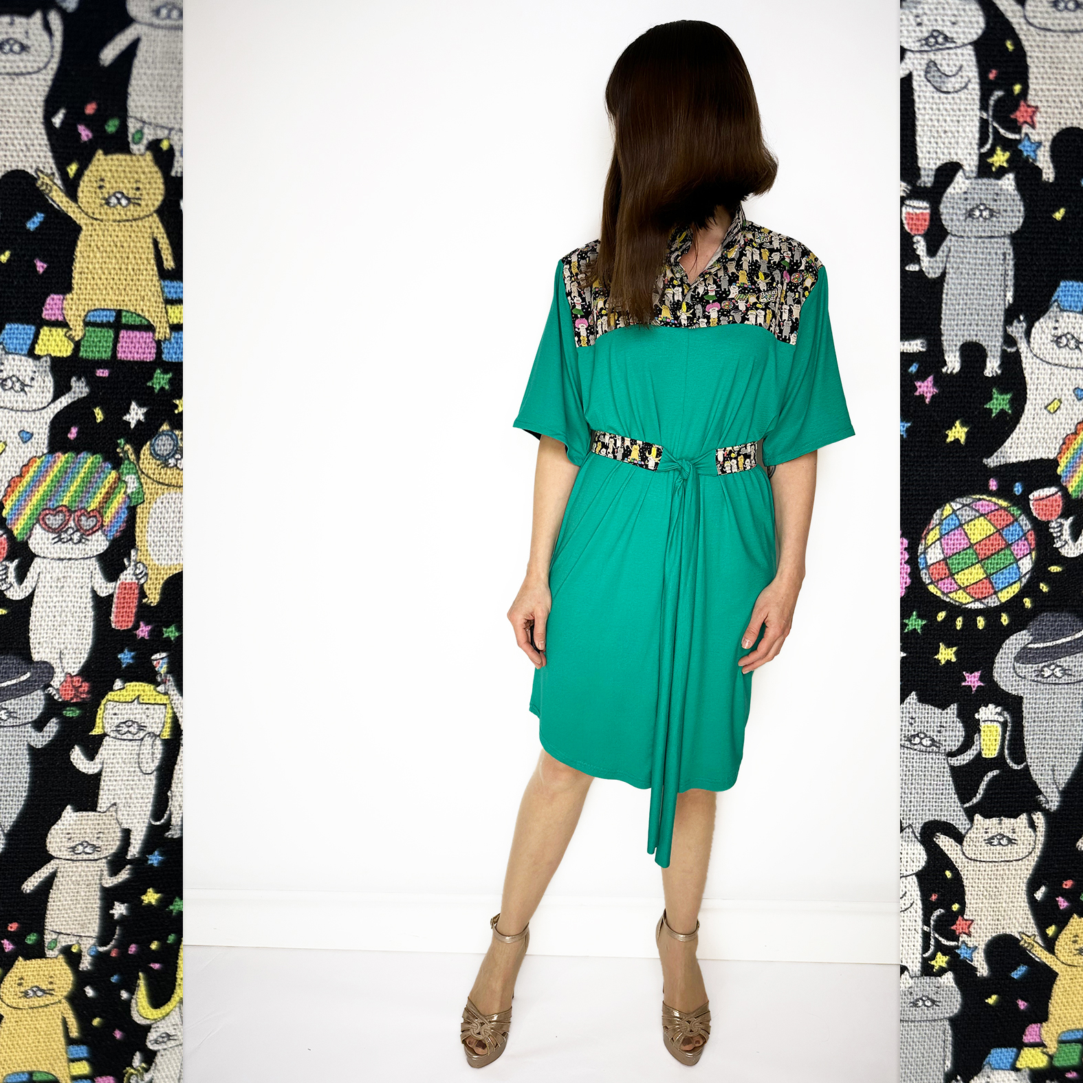 Discover our stunning Flowy Green Dress adorned with playful Japanese Party Cats! Flowy Green Dress with Japanese Party Cats Print: Features a versatile sash for customizable shaping, chic half sleeves with black cotton bias tape, and a comfortable fit crafted from a luxurious blend of 96% viscose and 4% elastane jersey fabric. Unique design highlights shoulders, collar, and belt crafted from exquisite Japanese cotton printed fabric. Meticulously designed and handmade in Studio Catta Amsterdam. FREE NL shipping & €12 worldwide shipping.