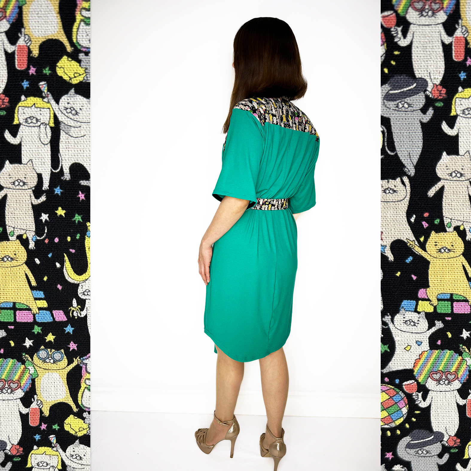 Discover our stunning Flowy Green Dress adorned with playful Japanese Party Cats! Flowy Green Dress with Japanese Party Cats Print: Features a versatile sash for customizable shaping, chic half sleeves with black cotton bias tape, and a comfortable fit crafted from a luxurious blend of 96% viscose and 4% elastane jersey fabric. Unique design highlights shoulders, collar, and belt crafted from exquisite Japanese cotton printed fabric. Meticulously designed and handmade in Studio Catta Amsterdam. FREE NL shipping & €12 worldwide shipping.