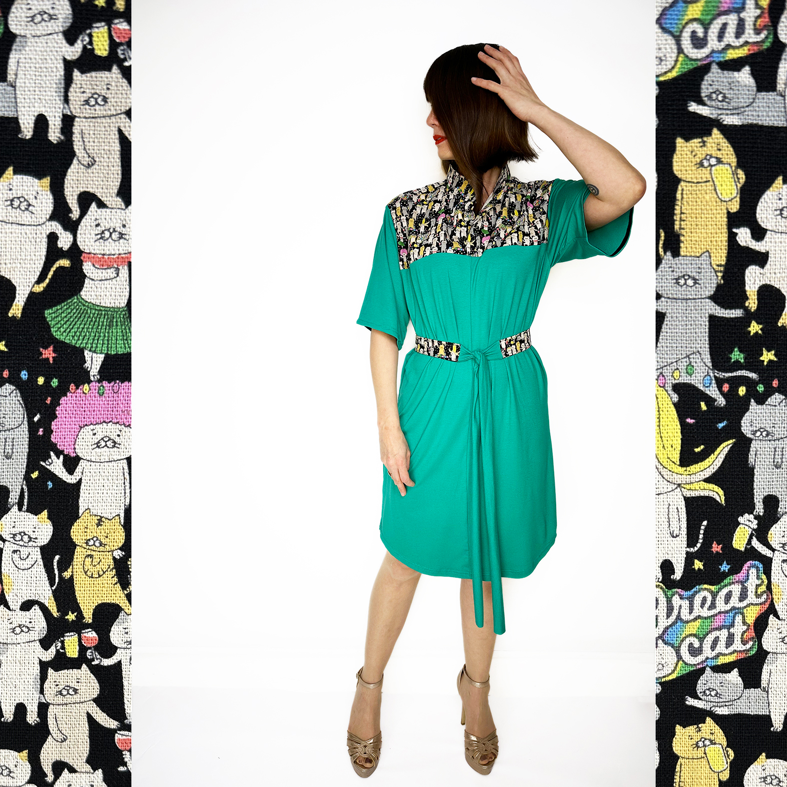 Discover our stunning Flowy Green Dress adorned with playful Japanese Party Cats! Flowy Green Dress with Japanese Party Cats Print: Features a versatile sash for customizable shaping, chic half sleeves with black cotton bias tape, and a comfortable fit crafted from a luxurious blend of 96% viscose and 4% elastane jersey fabric. Unique design highlights shoulders, collar, and belt crafted from exquisite Japanese cotton printed fabric. Meticulously designed and handmade in Studio Catta Amsterdam. FREE NL shipping & €12 worldwide shipping.