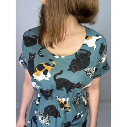 Enchanting Teal Green Dress with Japanese Cats Print: Crafted from 100% premium Japanese cotton, featuring a flattering elastic waist, classic neckline, and versatile roll-up sleeves. Meticulously designed and handmade in Studio Catta, Amsterdam, for impeccable quality. FREE shipping within the Netherlands and affordable worldwide rates!