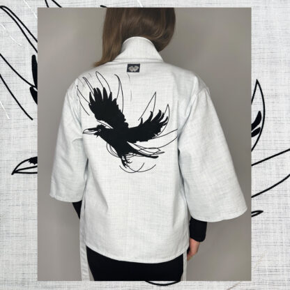 Happi coat with black velvet raven print on the back, handcrafted in Amsterdam by sustainable fashion designer Catta.