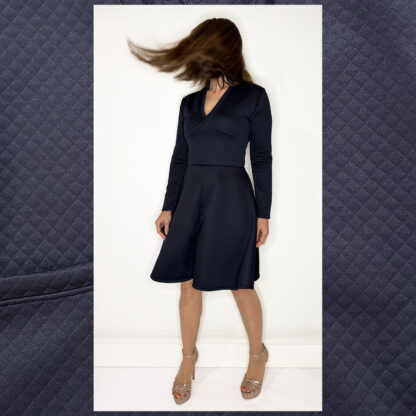 Elegant long-sleeve wrap dress with deep V-neckline and A-line skirt by Studio Catta Slowfashion Amsterdam.